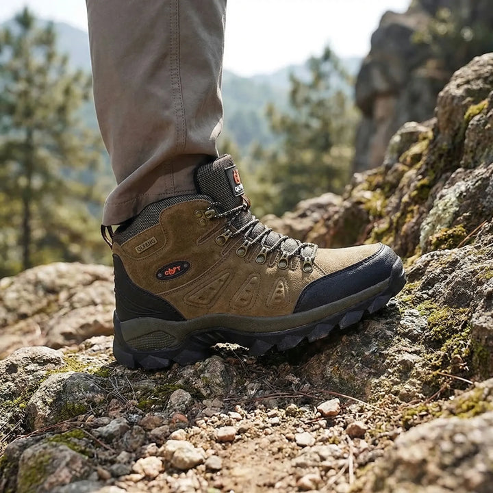 Unisex high-top hiking boots, durable for trail adventures with rugged all-terrain traction.