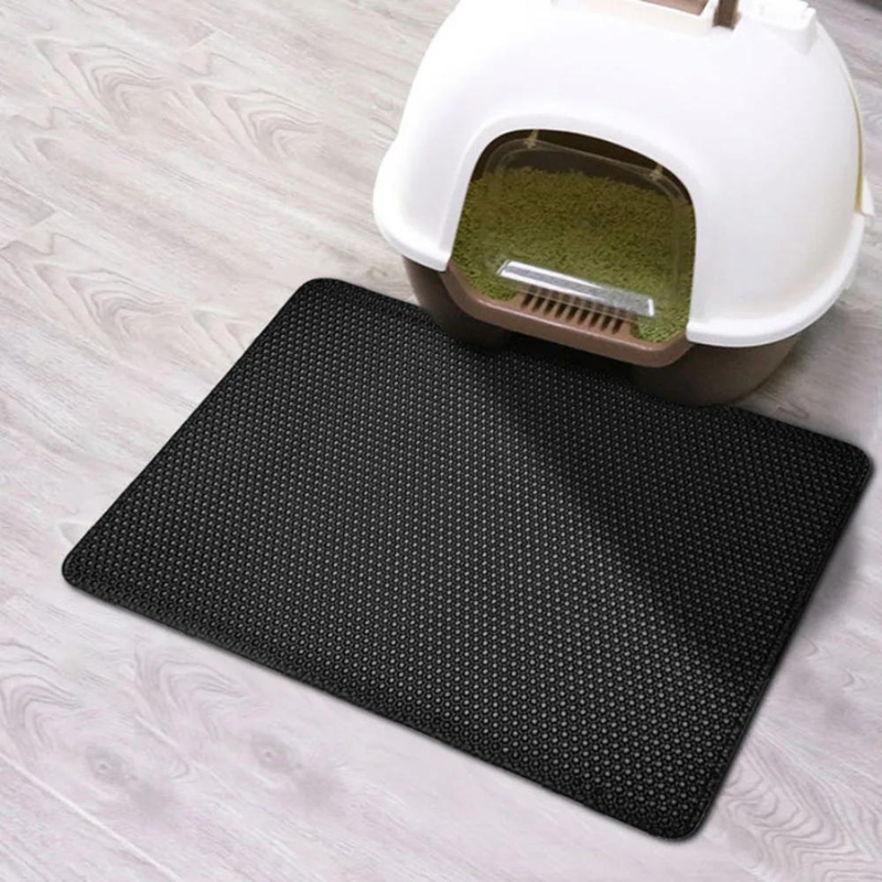 Water-resistant cat litter mat in a bathroom, under a litter box, demonstrating non-slip grip