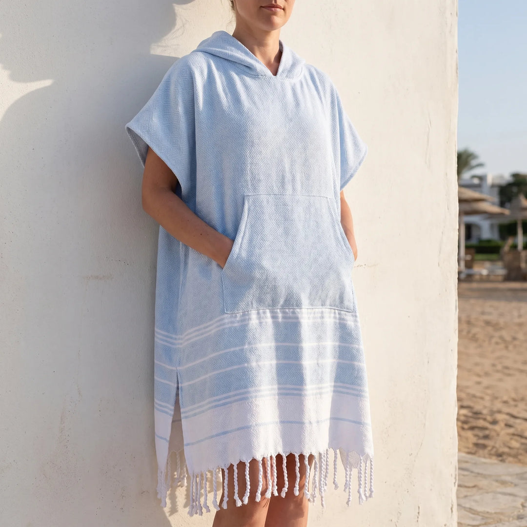 Unisex hooded beach towel poncho for easy changing after swim. Quick-dry & sand-resistant.