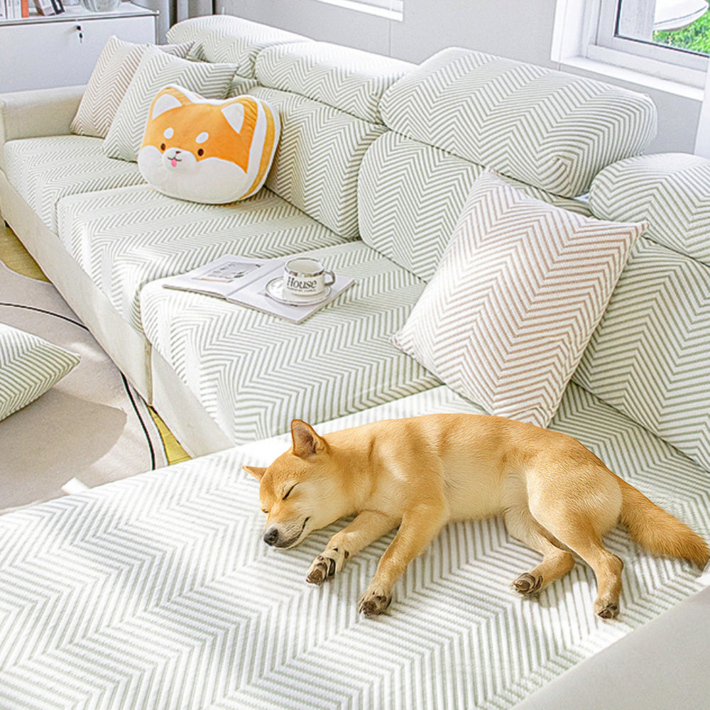 Unisex ice silk stretch sofa cover in a neutral color, providing cool comfort and furniture protection.