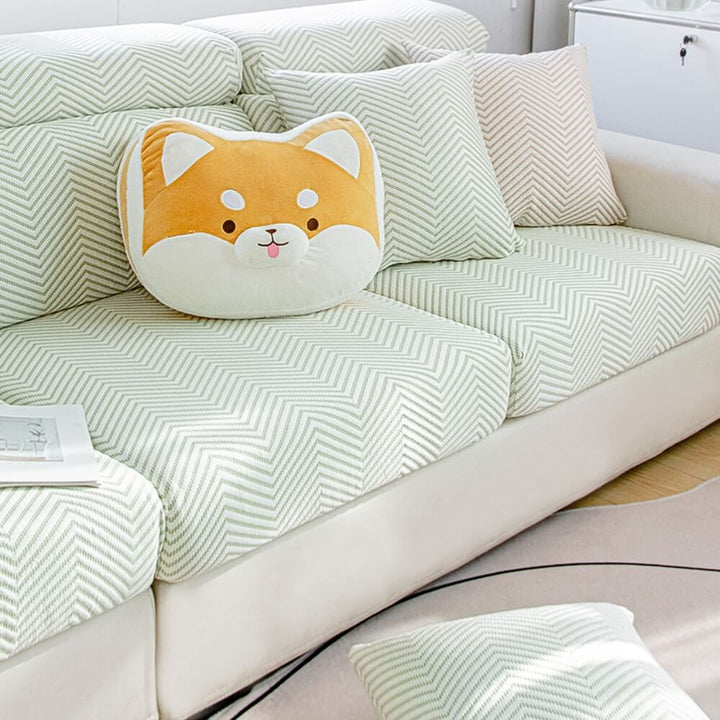 Washable ice silk stretch couch protector draped over a sofa, showing wrinkle-free fit.