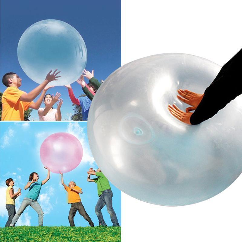 Children playing with a large, safe, inflatable bubble ball, perfect summer outdoor toy.