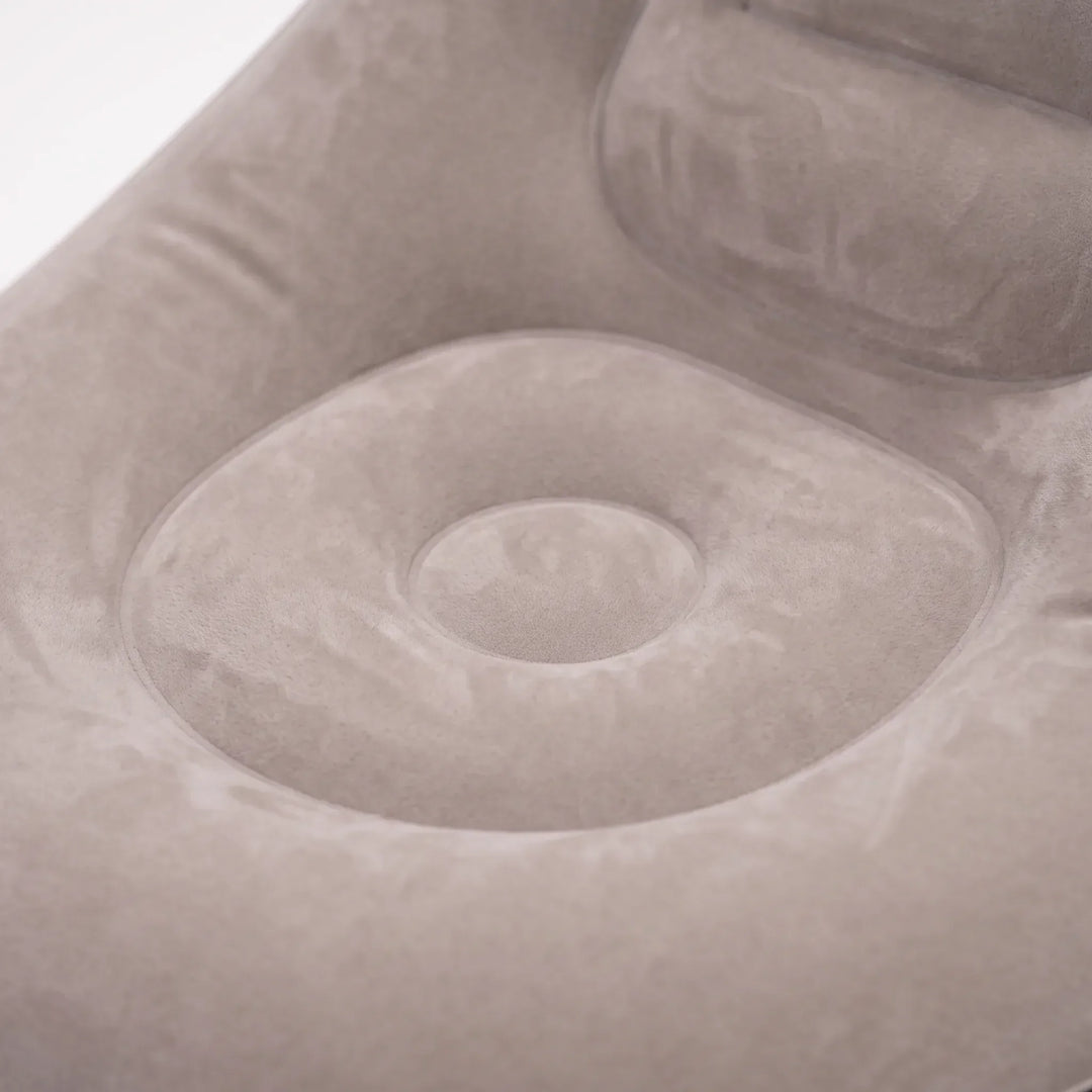 Comfortable inflatable air chair and ottoman set, offering relaxing indoor and outdoor lounge seating.