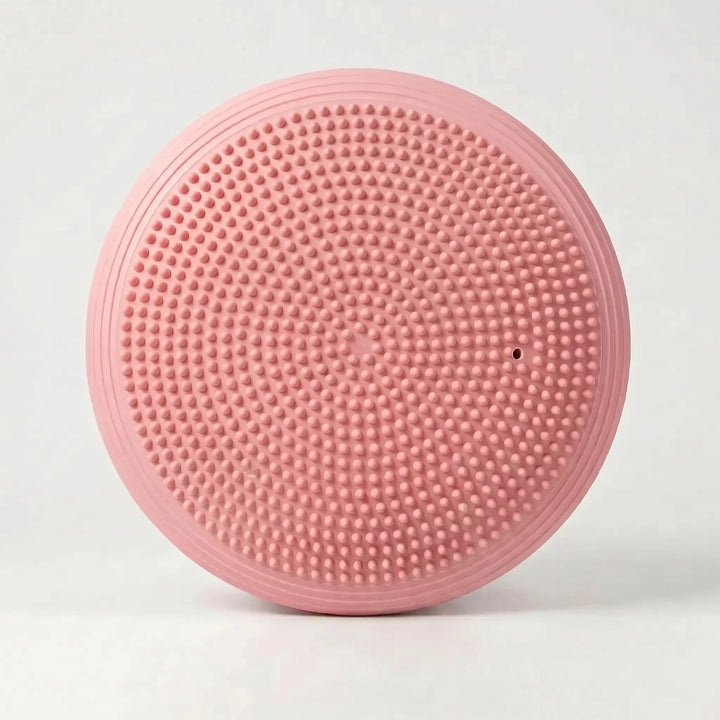 Round inflatable balance pad for improving core stability, strength, and overall fitness. Unisex workout aid.