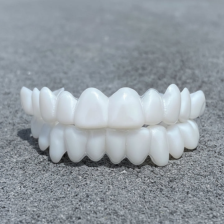 Temporary, removable cosmetic tooth covers for an instant, confident white smile.