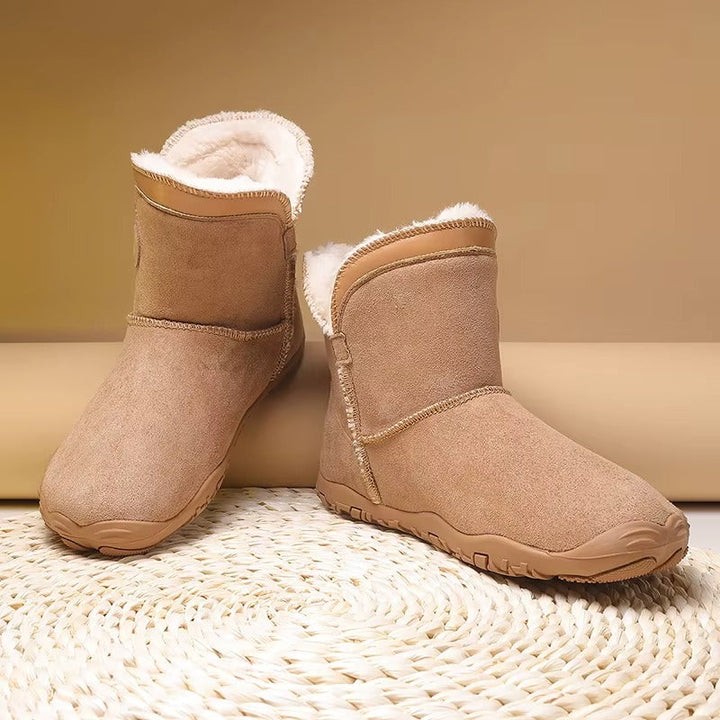 Sleek unisex barefoot winter boots with warm insulation & flexible sole for natural comfort.