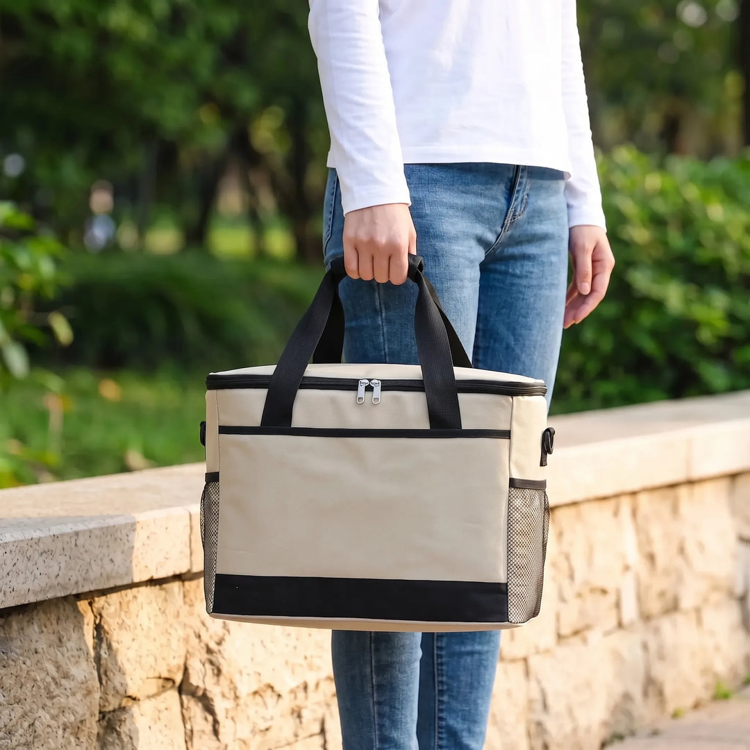 Unisex insulated cooler bag in a neutral color, perfect for keeping food fresh during outdoor picnics & camping.