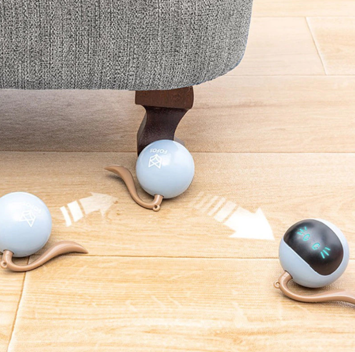 Spherical LED cat toy demonstrating its interactive light patterns, keeping cats entertained