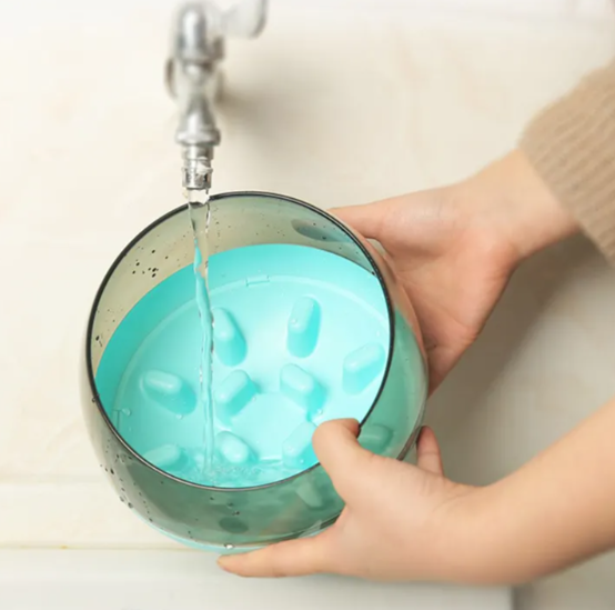 Close-up of a slow feeder dog bowl, showing its unique anti-gulp design for pet health and slower eating.