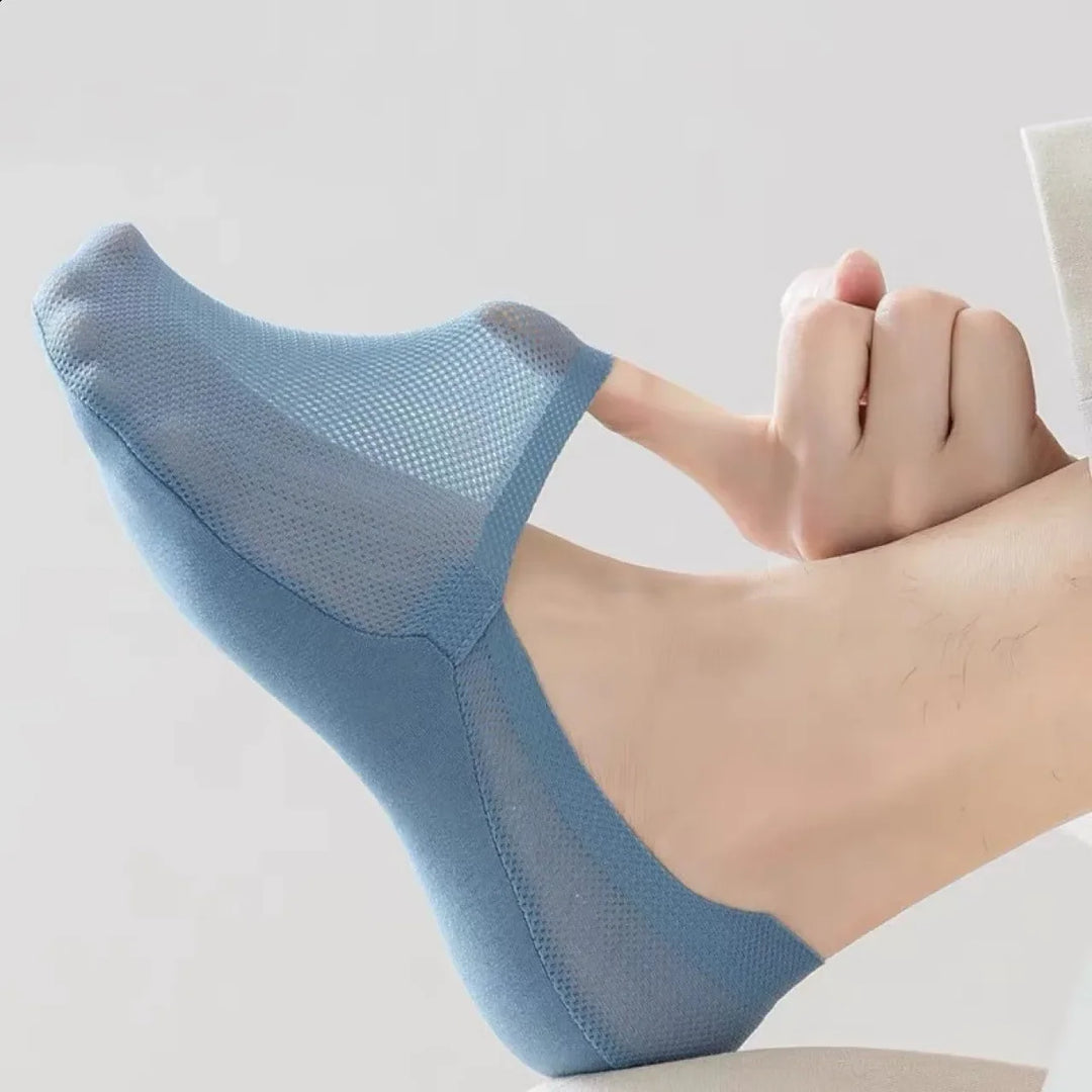Anti-slip invisible no-show socks providing ultimate foot comfort for men & women, essential everyday wear.