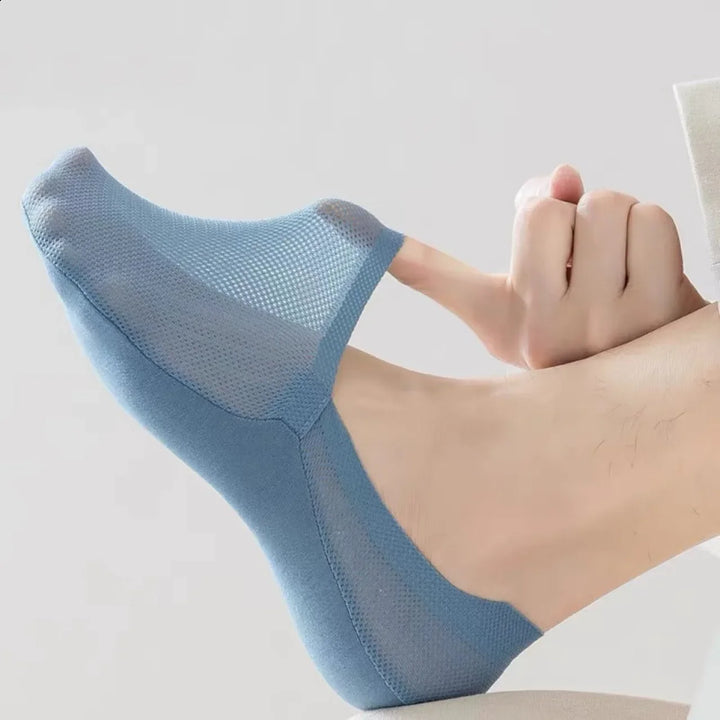 Anti-slip invisible no-show socks providing ultimate foot comfort for men & women, essential everyday wear.