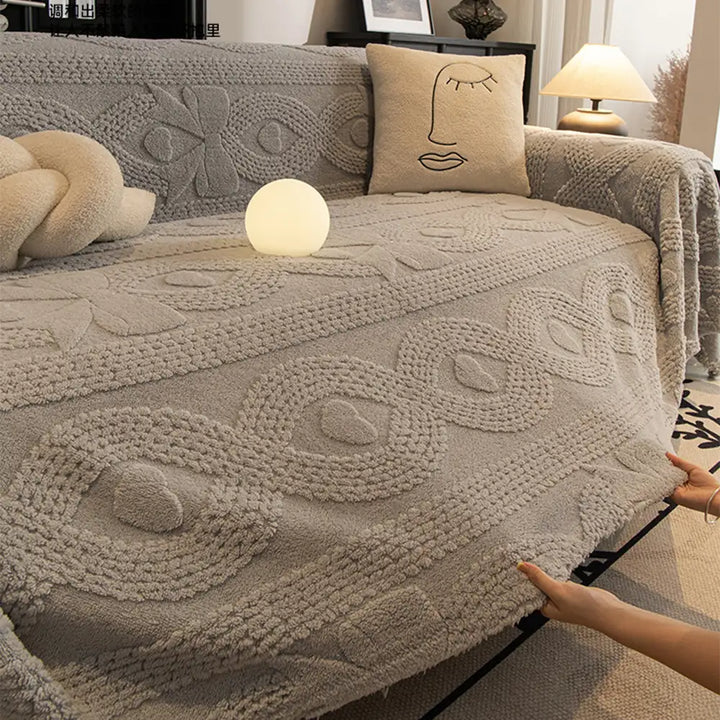 Warm and inviting jacquard sofa throw, a key piece of soft home decor