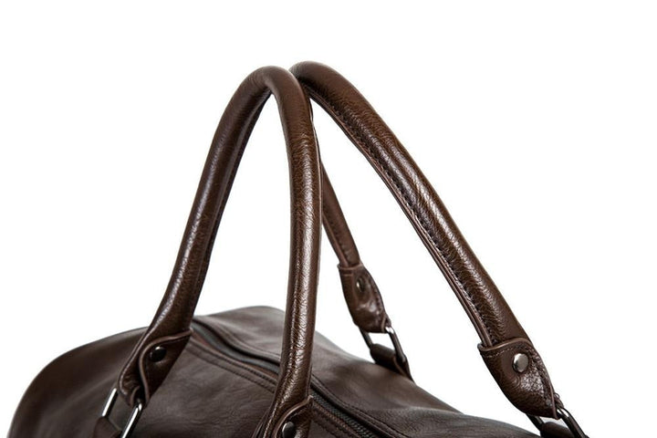 Premium brown faux leather travel duffel for men & women, spacious carry-on luggage.
