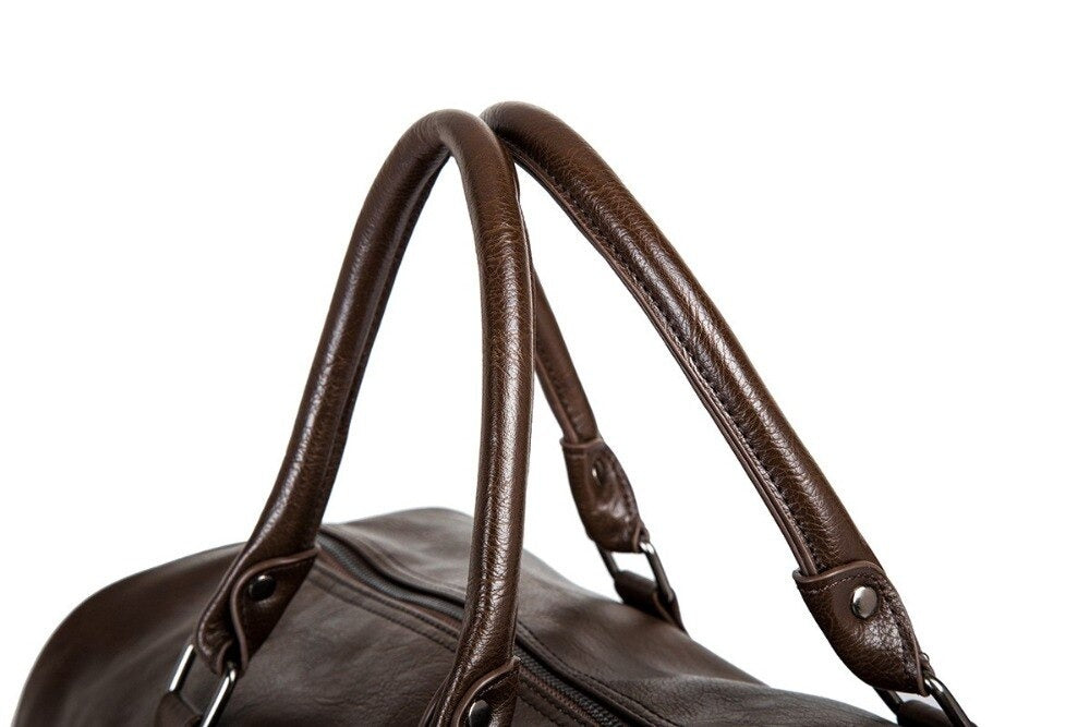Spacious brown faux leather unisex travel duffel, perfect as a carry-on or weekend bag.