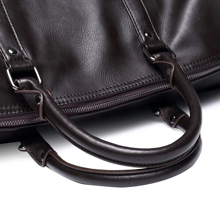 Elegant brown faux leather travel duffel, a large carry-on bag suitable for any traveler.