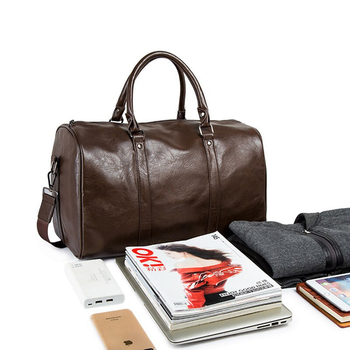Large black faux leather gym duffel bag, also great as a unisex weekend or travel carry-on.