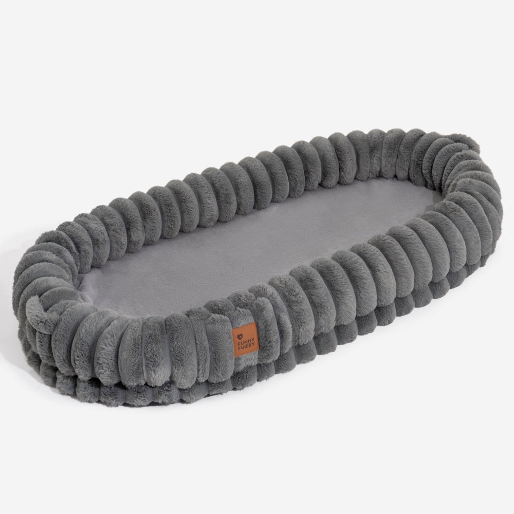 Unisex large pet bed from a side view, highlighting the deep orthopedic cushioning.