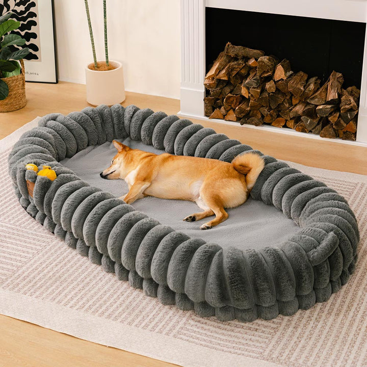 Pet calming donut bed shown from above, plush material inviting comfort for large pets.