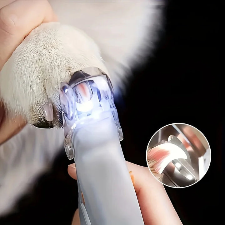 Close-up of LED pet nail clippers for safe trimming, showing bright light and sharp stainless steel
