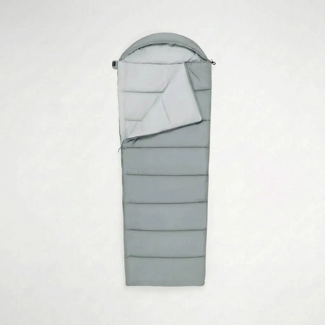 Durable polyester envelope sleeping bag for unisex camping, hiking, and outdoor travel. Lightweight design.