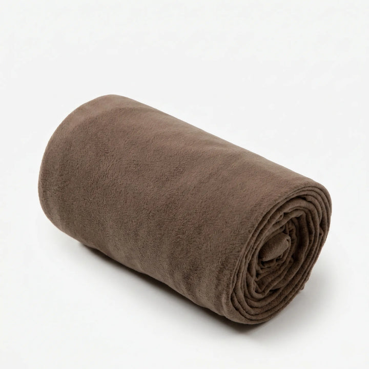 Portable adult fleece sleeping bag liner, neatly folded for backpacking & travel. Lightweight camping gear.