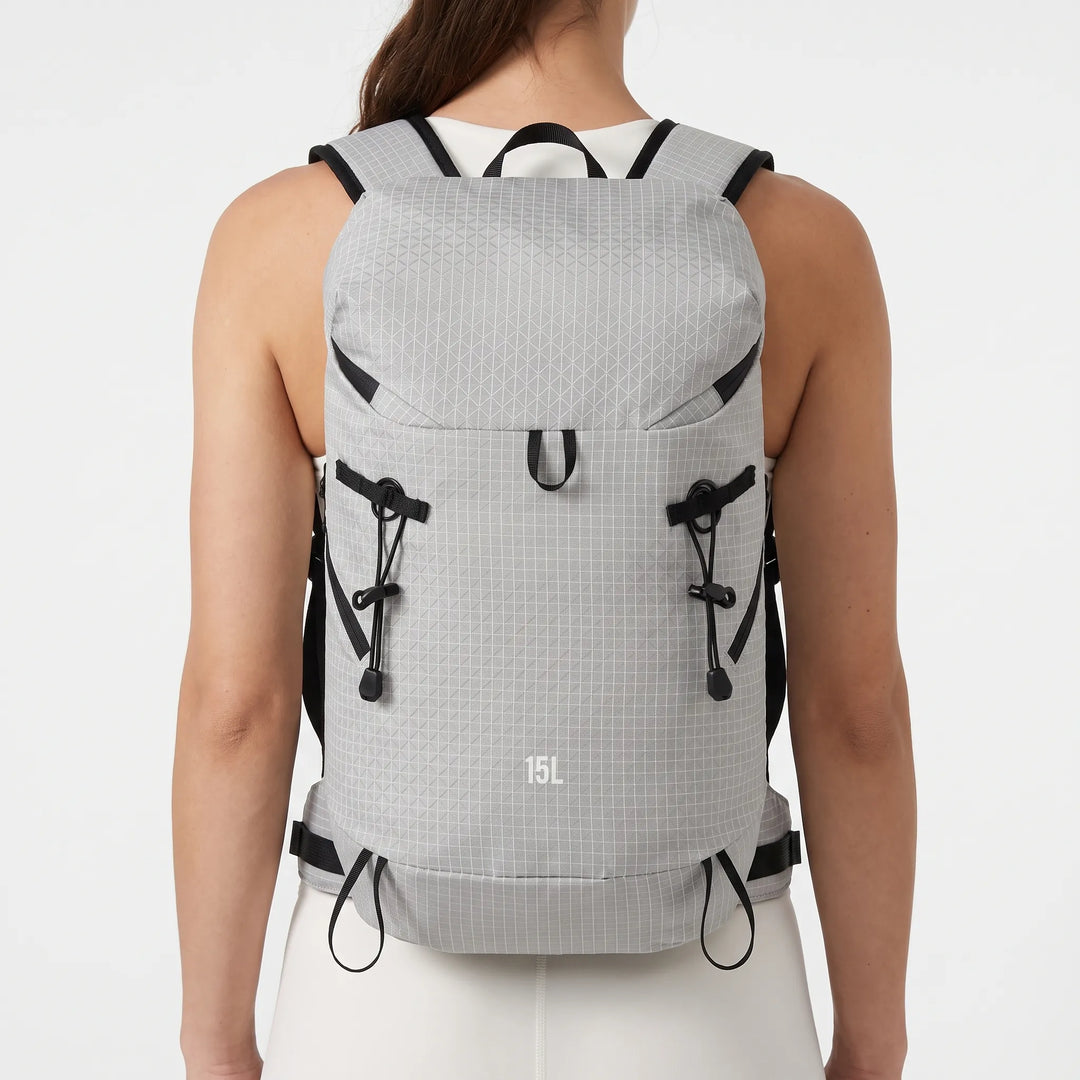 Front view of a unisex lightweight hiking backpack with hydration sleeve, perfect for trail running & outdoor travel.