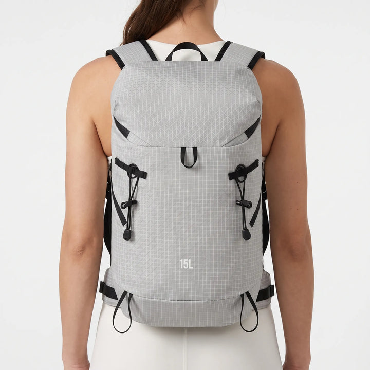 Front view of a unisex lightweight hiking backpack with hydration sleeve, perfect for trail running & outdoor travel.