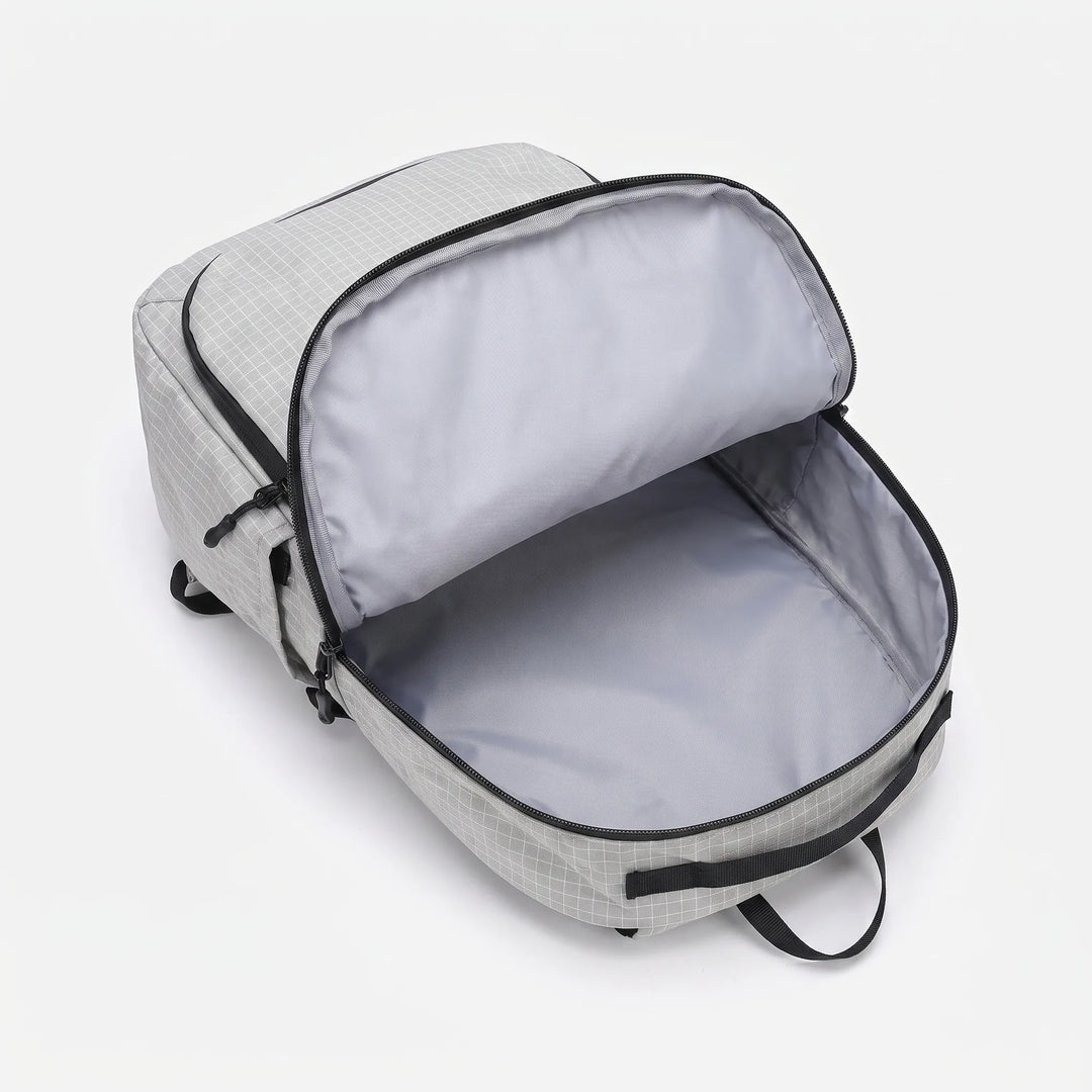 Lightweight hiking pack featuring an integrated hydration bladder sleeve for easy outdoor trail & camping use. Unisex.