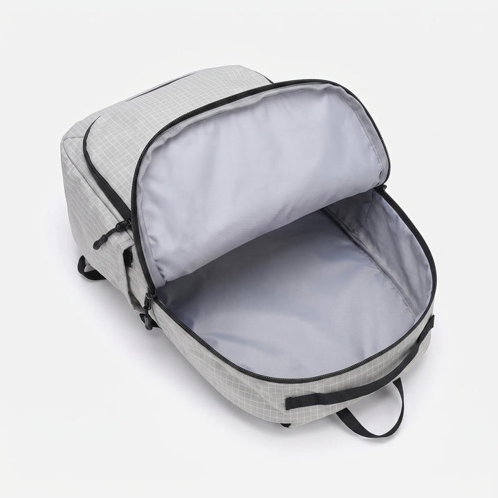 Lightweight hiking pack featuring an integrated hydration bladder sleeve for easy outdoor trail & camping use. Unisex.