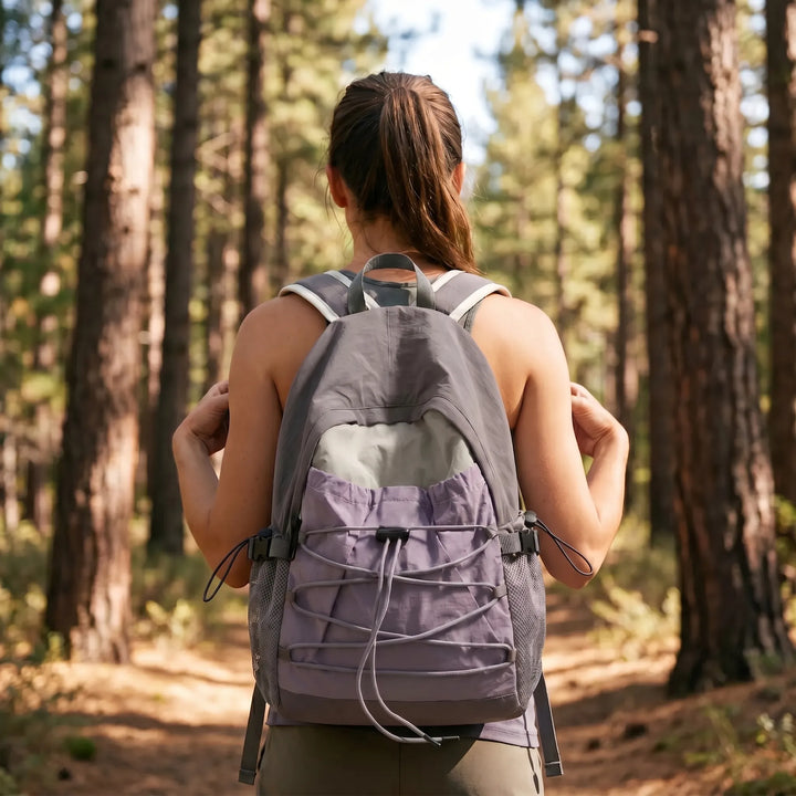 Unisex lightweight outdoor travel backpack for hiking, daily commute, and adventure, made of durable nylon.