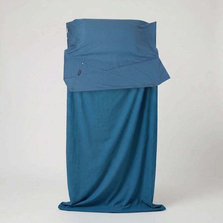 Compact travel liner for sleeping bags, essential gear for hikers, campers, and backpackers seeking comfort.