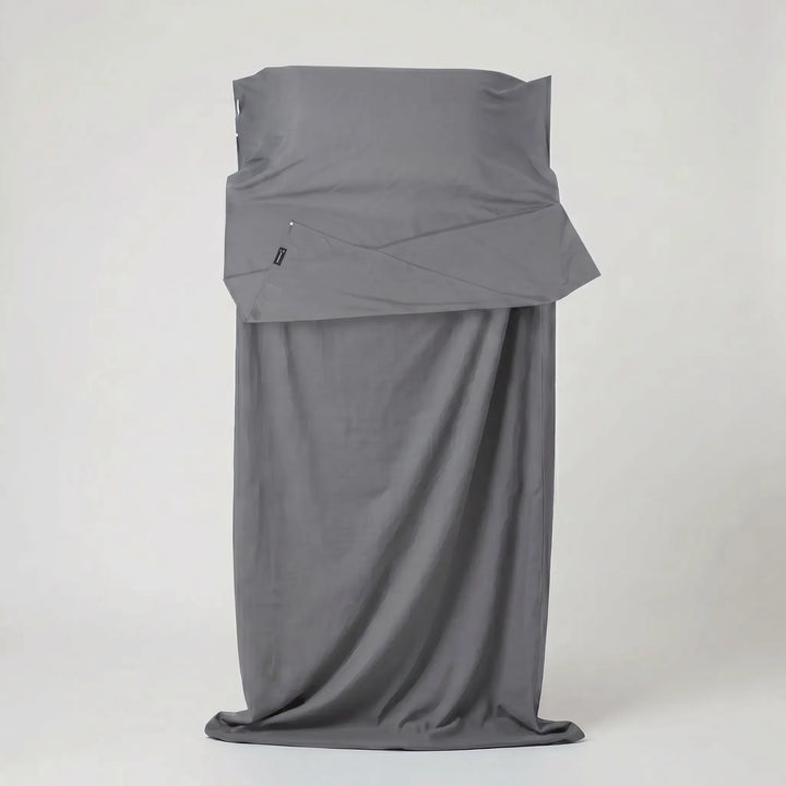 Packable travel sleeping bag liner, perfect for outdoor adventures, backpacking, and improving sleep comfort.