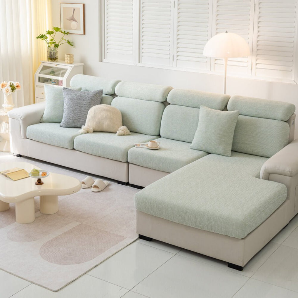 Living room scene with a new linen-blend stretch sofa cover, enhancing decor and offering pet-friendly protection