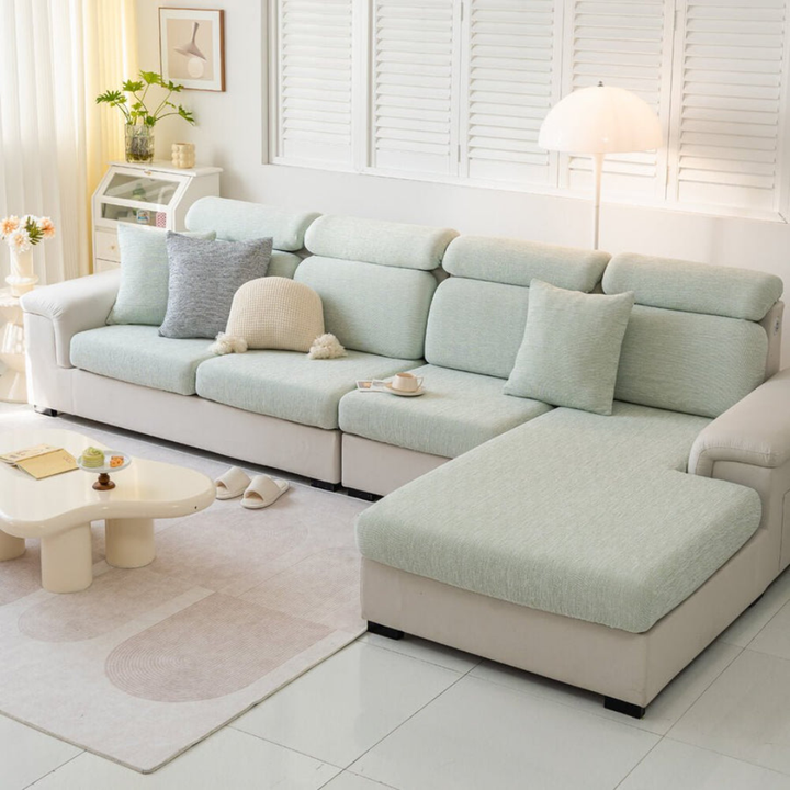 Living room scene with a new linen-blend stretch sofa cover, enhancing decor and offering pet-friendly protection