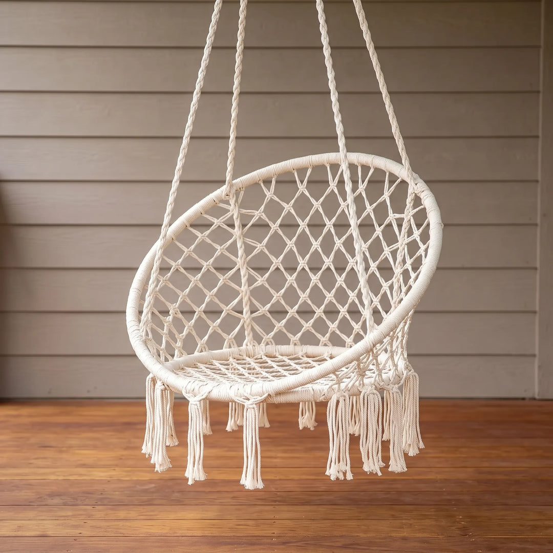 Handmade macrame hanging chair with intricate bohemian design, ideal for cozy indoor or outdoor seating.