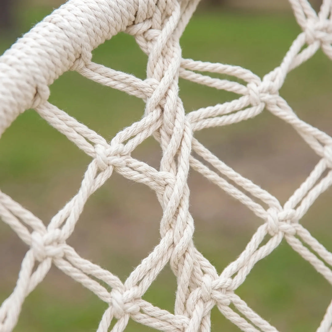 Comfortable macrame hammock swing chair, providing a relaxing bohemian seating experience for any space.