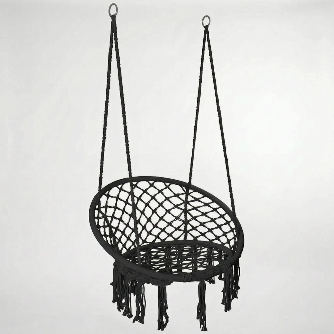 Bohemian macrame swing chair with fringe detail, a chic indoor/outdoor seating solution for any home.