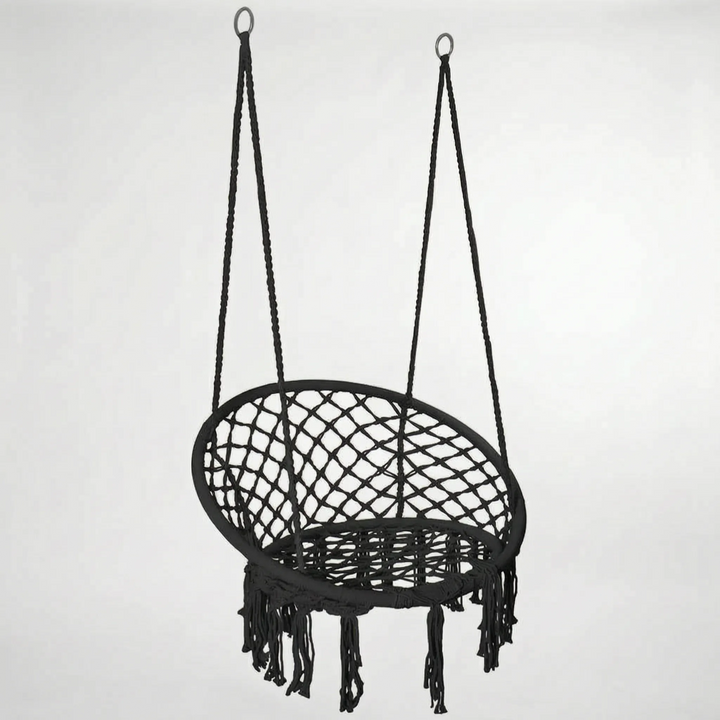 Bohemian macrame swing chair with fringe detail, a chic indoor/outdoor seating solution for any home.