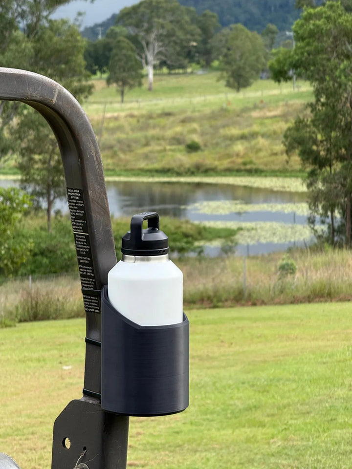 Strong magnetic bottle holder for workshop tools. Keep drinks secure & hands-free in your garage or industrial space.