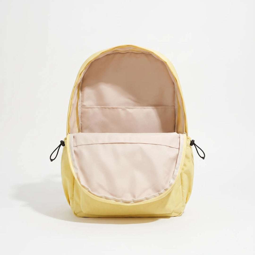 Stylish minimalist everyday backpack worn by a person, perfect for urban commuting & travel.