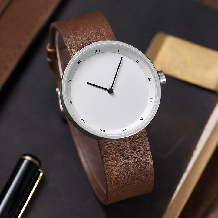 Unisex minimalist quartz wrist watch with a sleek design and black leather strap, perfect for any outfit.