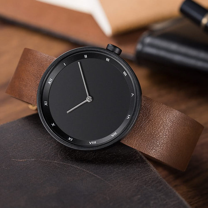 Brown leather minimalist quartz watch, a timeless unisex accessory with a simple, sophisticated face.