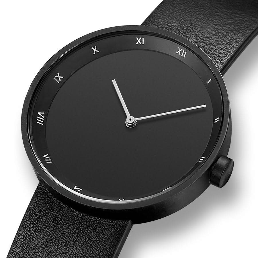 Brown leather minimalist wrist watch, an elegant quartz timepiece with a round face, ideal for daily wear.