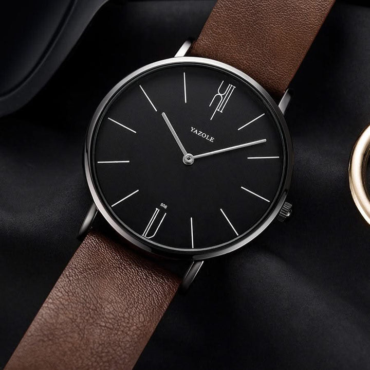 Elegant analog minimalist watch with a clean dial and a soft brown leather strap. A timeless unisex accessory.
