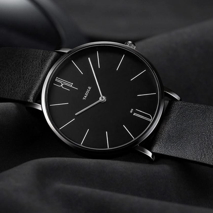 Unisex minimalist watch on a wrist, highlighting its elegant leather band and sleek stainless steel profile.