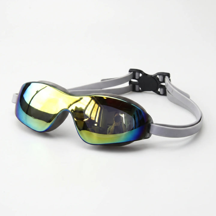 Close-up of stylish unisex mirrored swim eyewear, showing reflective anti-glare lenses & silicone seal.