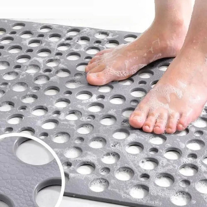 Senior safety bath mat with strong grip suction cups prevents slips, making bathroom time safer.