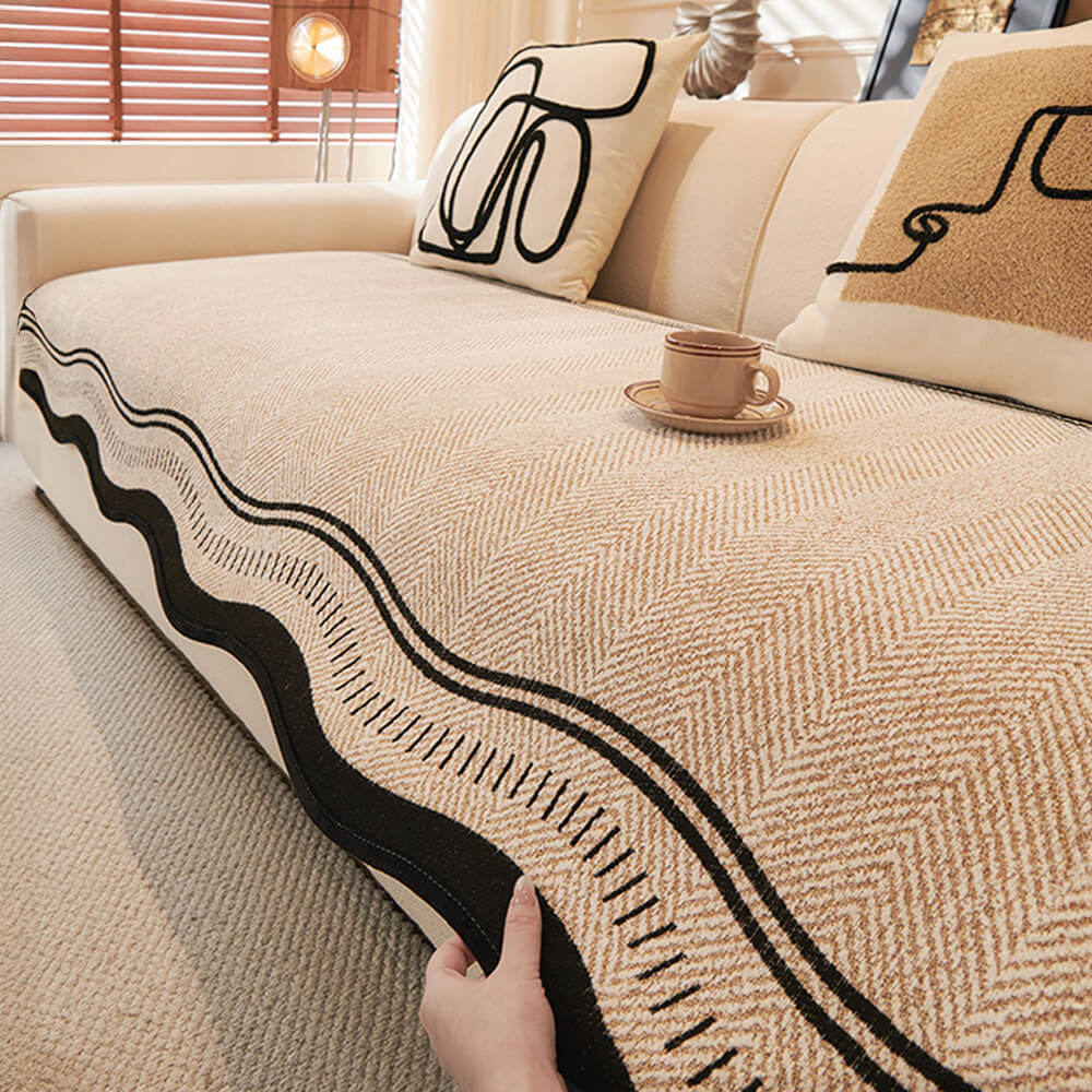 Unisex non-slip herringbone chenille couch cover in a cozy living room setting, ideal for pet owners.