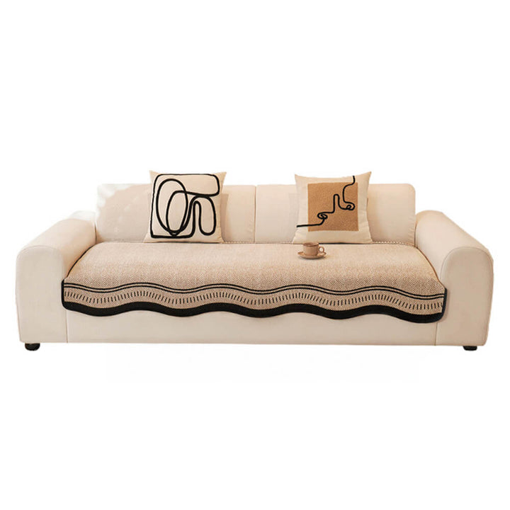 Non-slip herringbone chenille couch cover in an ecru color, enhancing living room aesthetics and comfort.