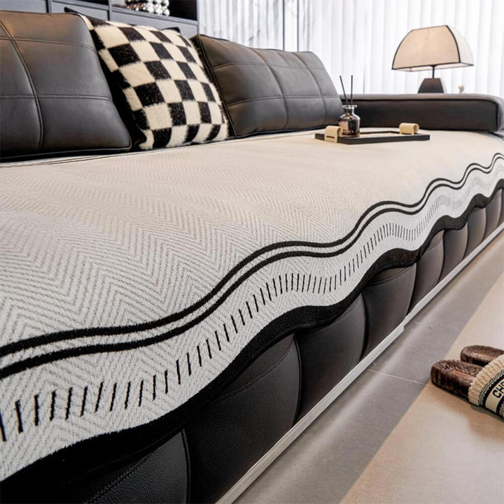 Stylish herringbone chenille couch cover in a neutral tone, providing excellent protection against spills and pets.